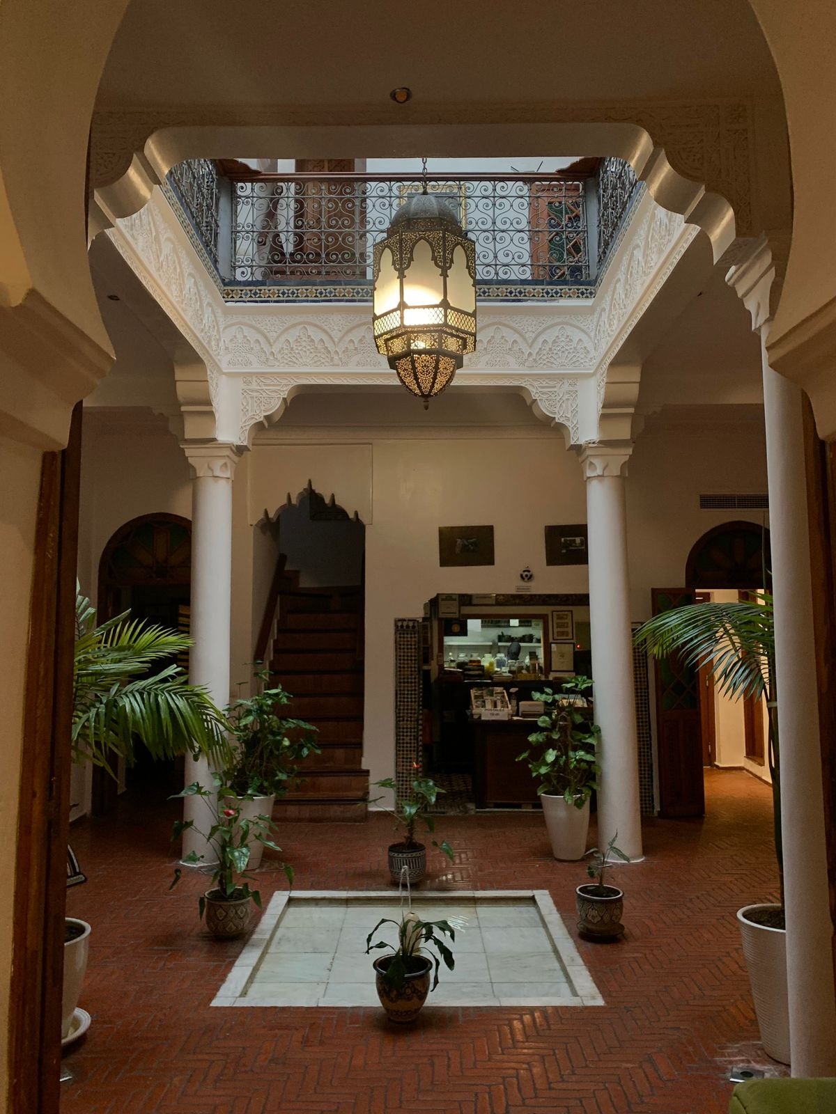 Traditional Moroccan riad interior courtyard, similar to Riad Amra's boutique setting in Bab Doukala, Marrakech