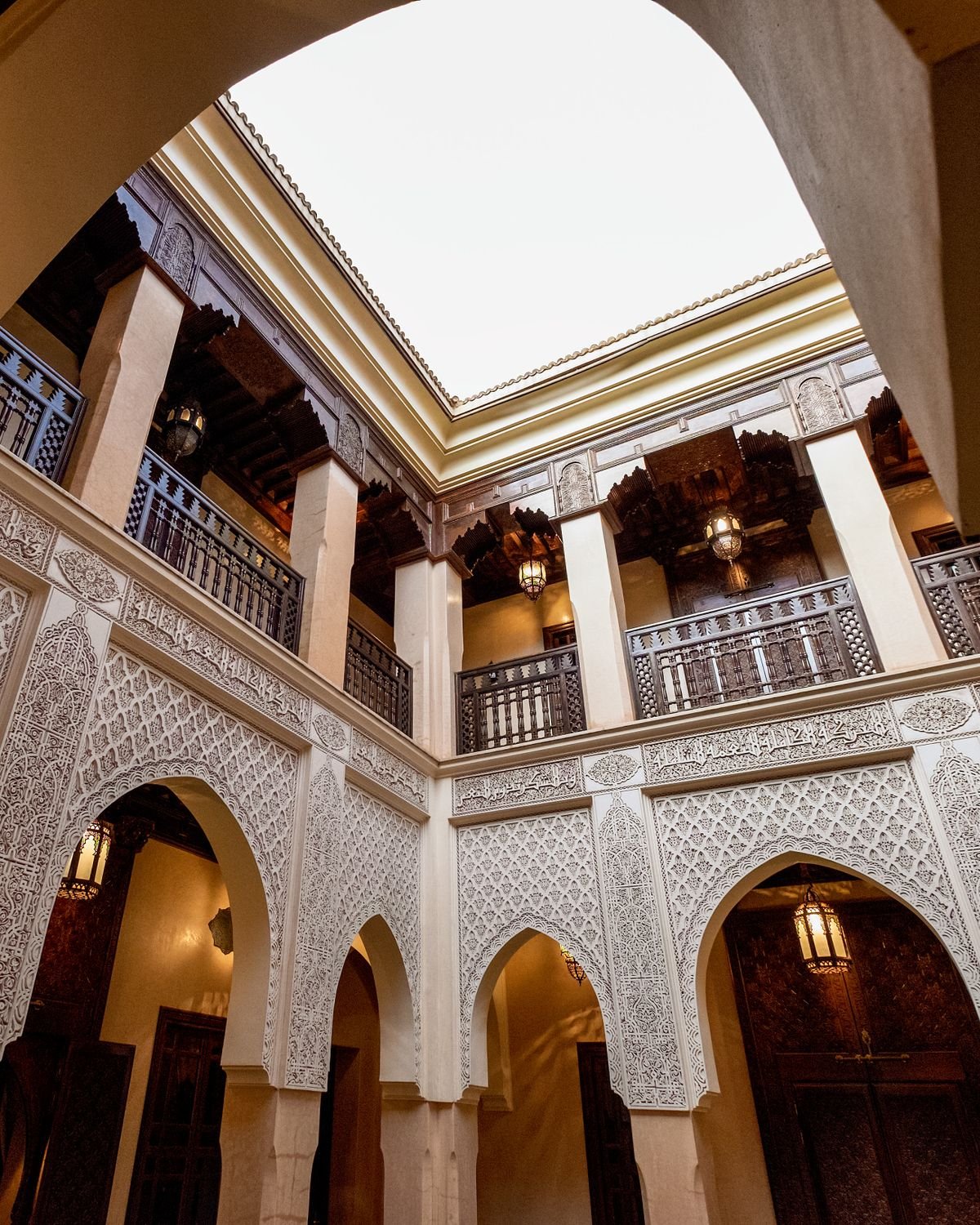 Traditional Moroccan riad interior courtyard with intricate tilework near Marrakech's Jemaa el-Fna